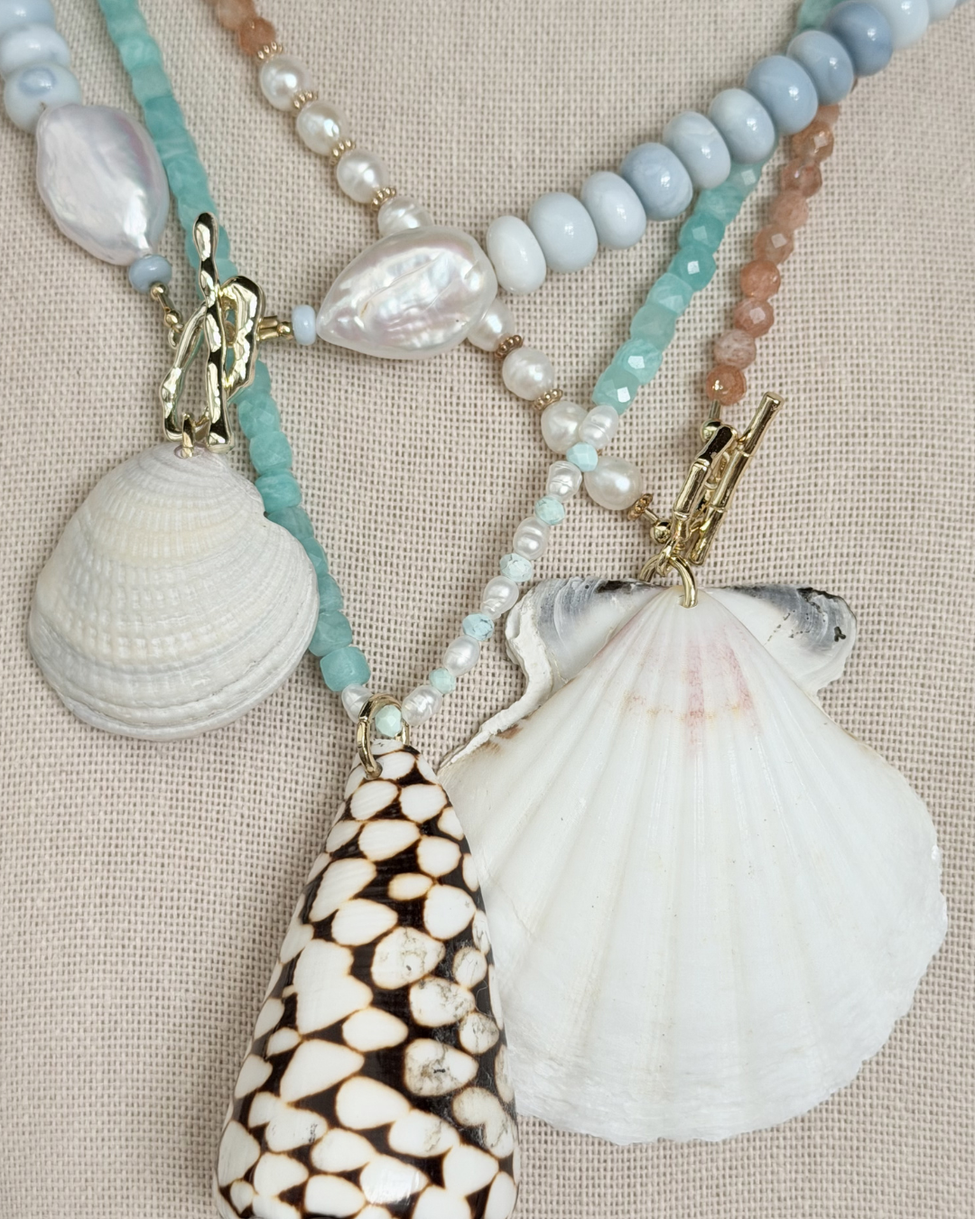 Turquoise and aquamarine jewelry styled with driftwood