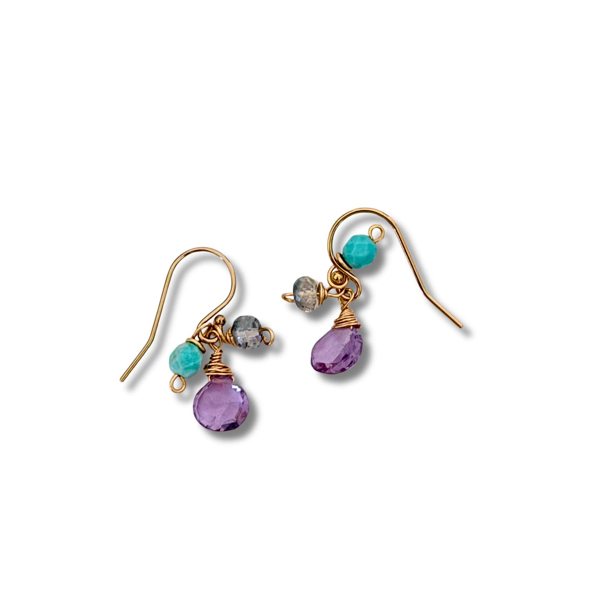 Gold earrings with amethyst and turquoise beads on a white background