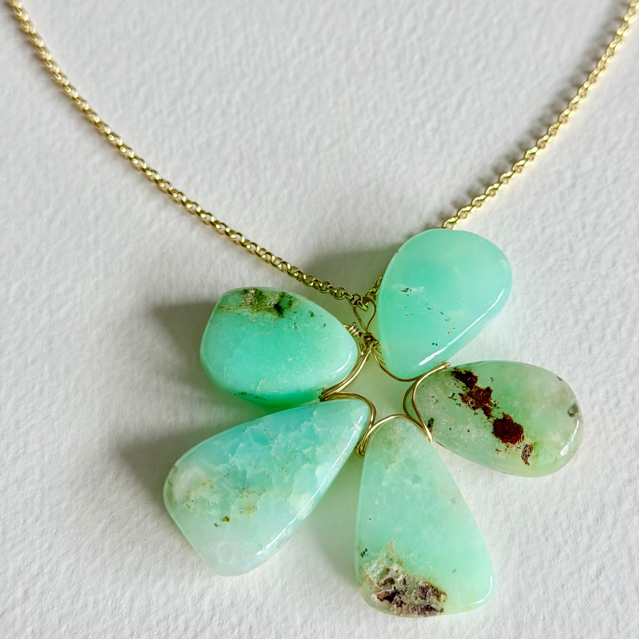 Turquoise stone necklace on a white background