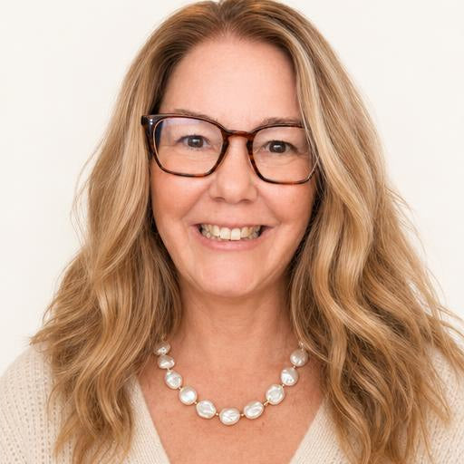 Chunky Baroque Pearl Necklace on a woman with light brown hair wearing a cream sweater