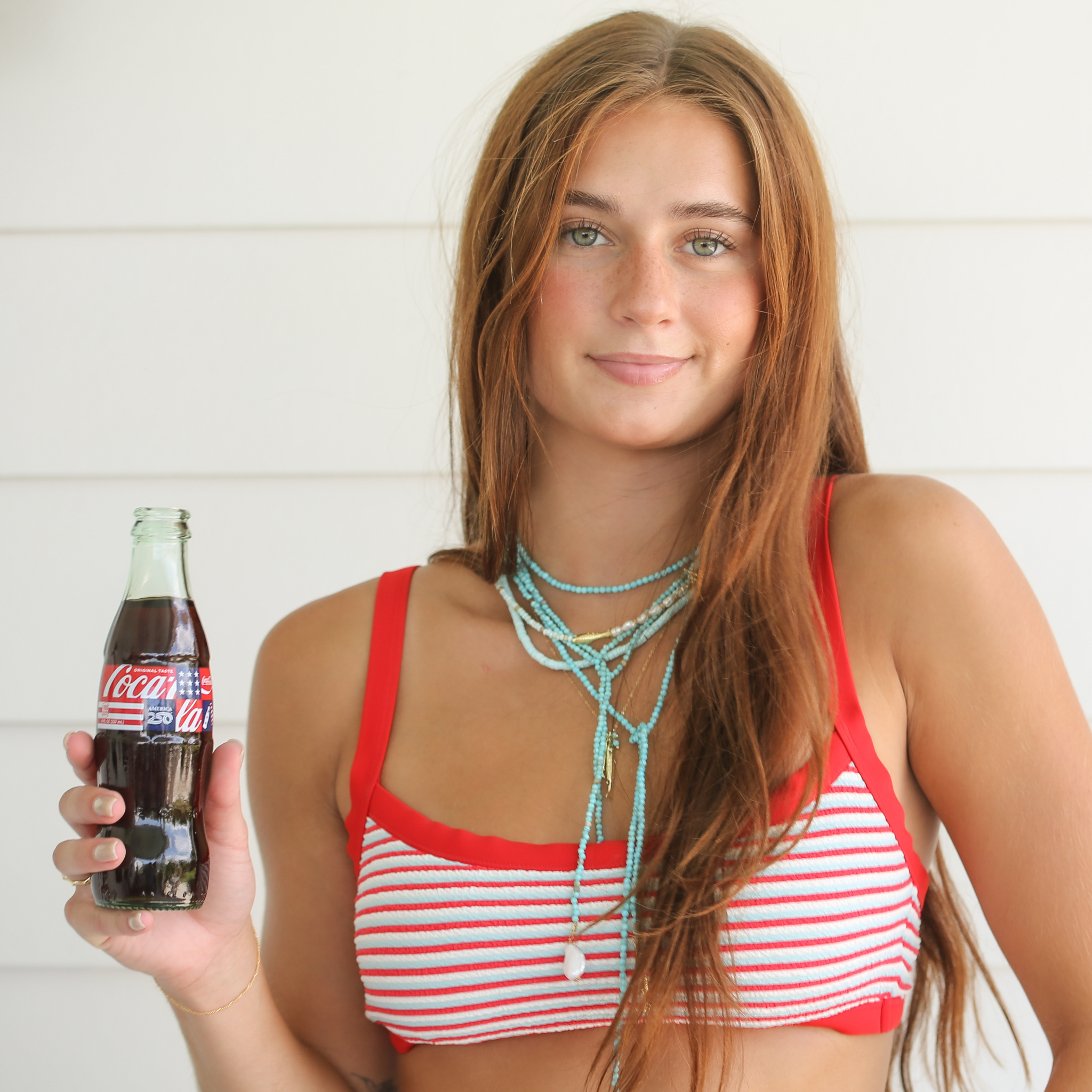 on model image of turquoise layered necklaces