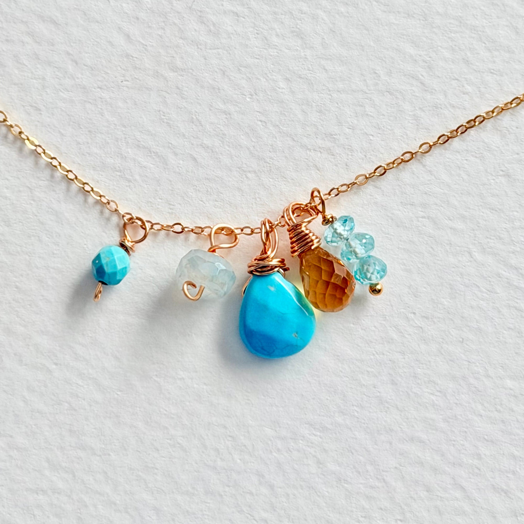 Necklace with blue and brown beads on a light gray background