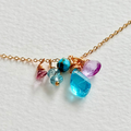 Necklace with colorful beads on a light background