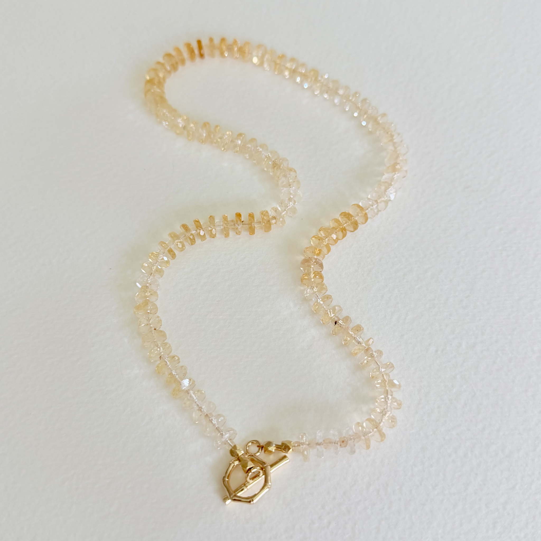 Golden Hour Citrine Necklace handcrafted with natural faceted citrine gemstones in a champagne-to-honey ombré and finished with a 14k gold-filled toggle clasp.