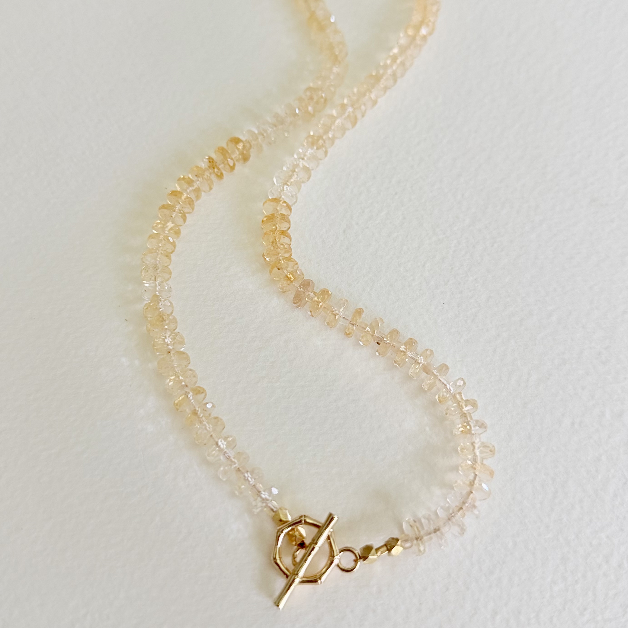 Golden Hour Citrine Necklace handcrafted with natural faceted citrine gemstones in a champagne-to-honey ombré and finished with a 14k gold-filled toggle clasp. 