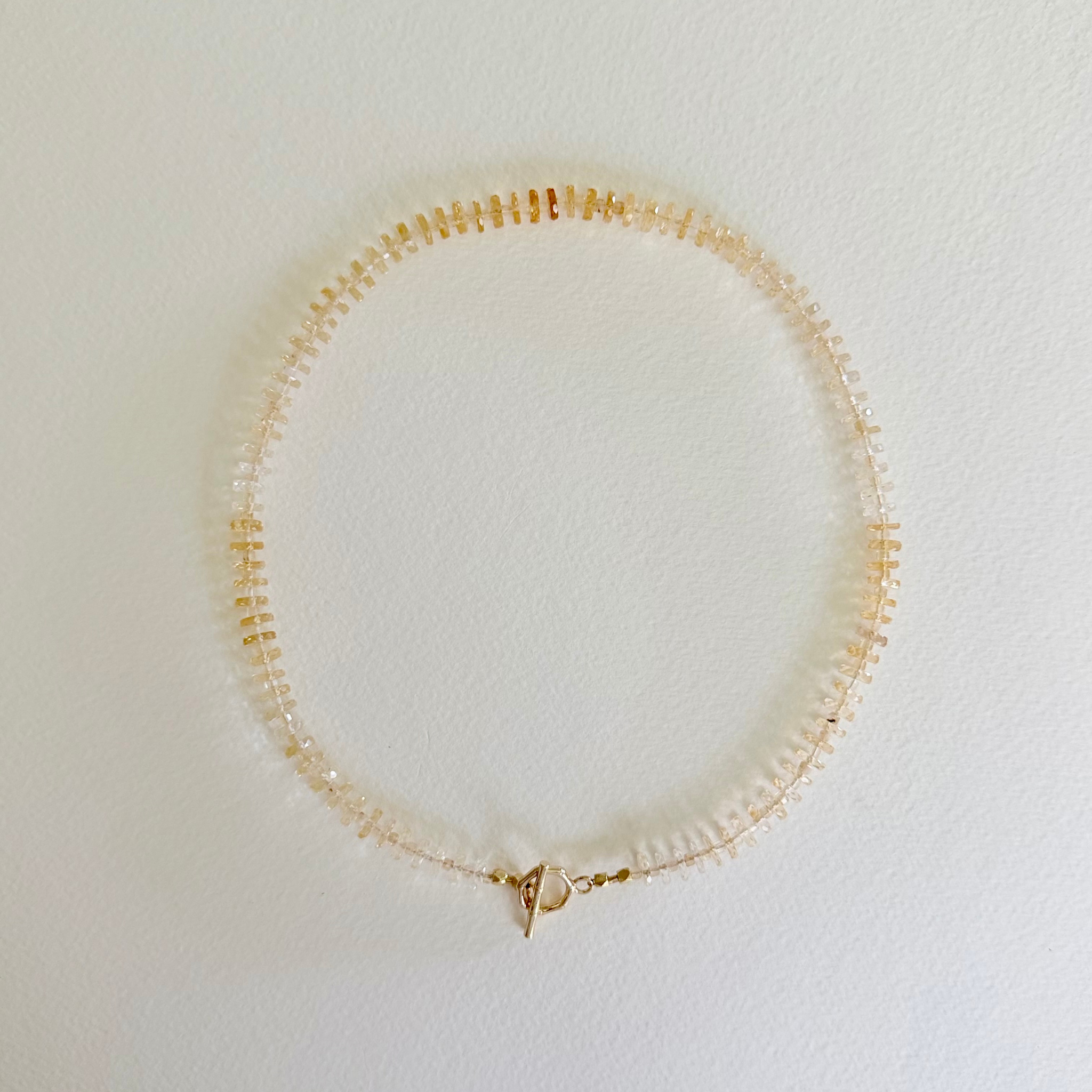 Golden Hour Citrine Necklace handcrafted with natural faceted citrine gemstones in a champagne-to-honey ombré and finished with a 14k gold-filled toggle clasp.