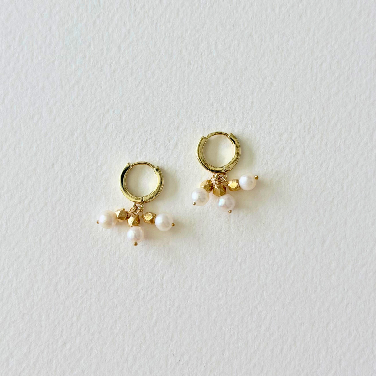 gold hoop huggie earrings with pearl charms