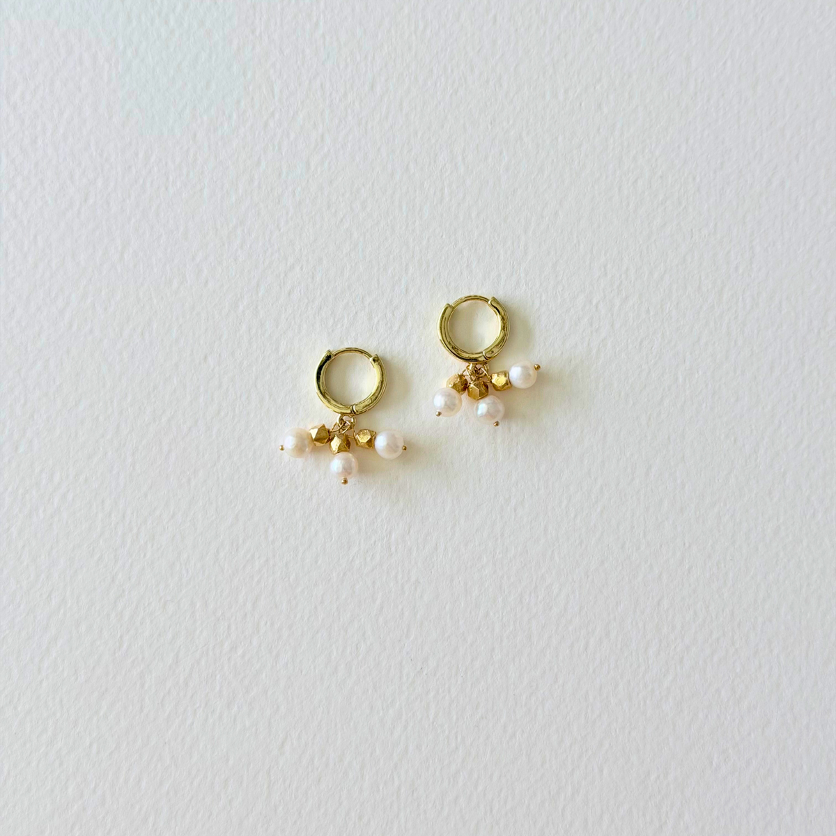 gold hoop huggie earrings with pearl charms