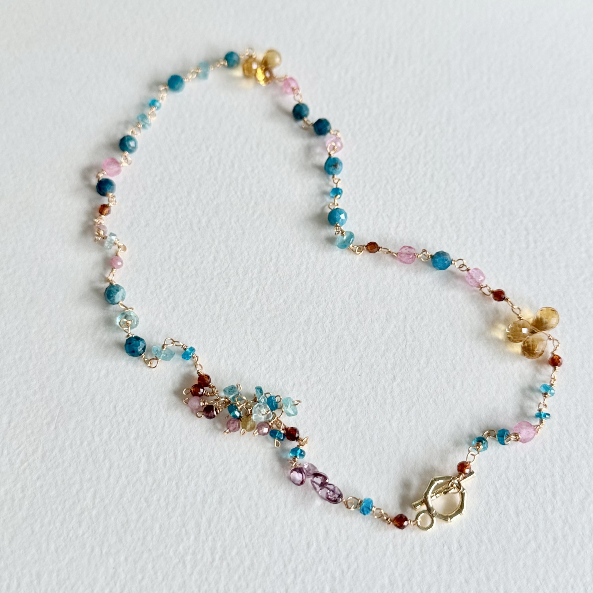 Multicolored beaded necklace on a white background