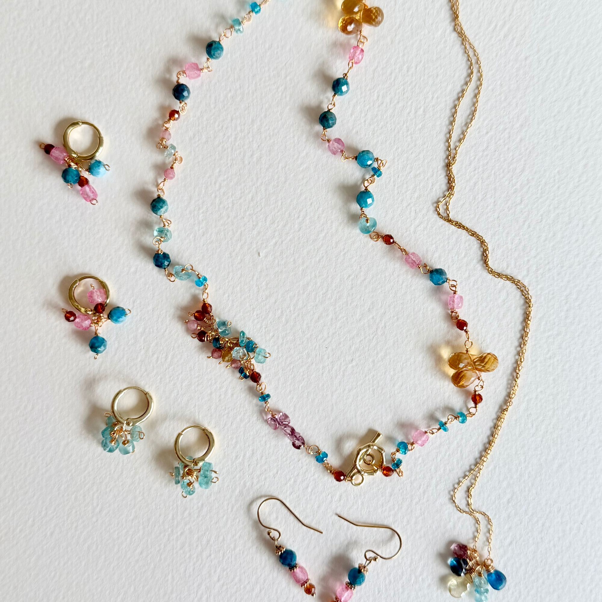 Jewelry set with necklace and earrings on a white background