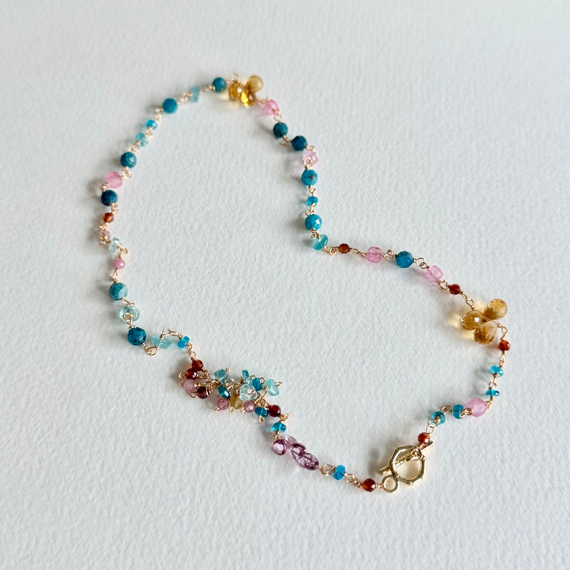 Multicolored beaded necklace on a white background