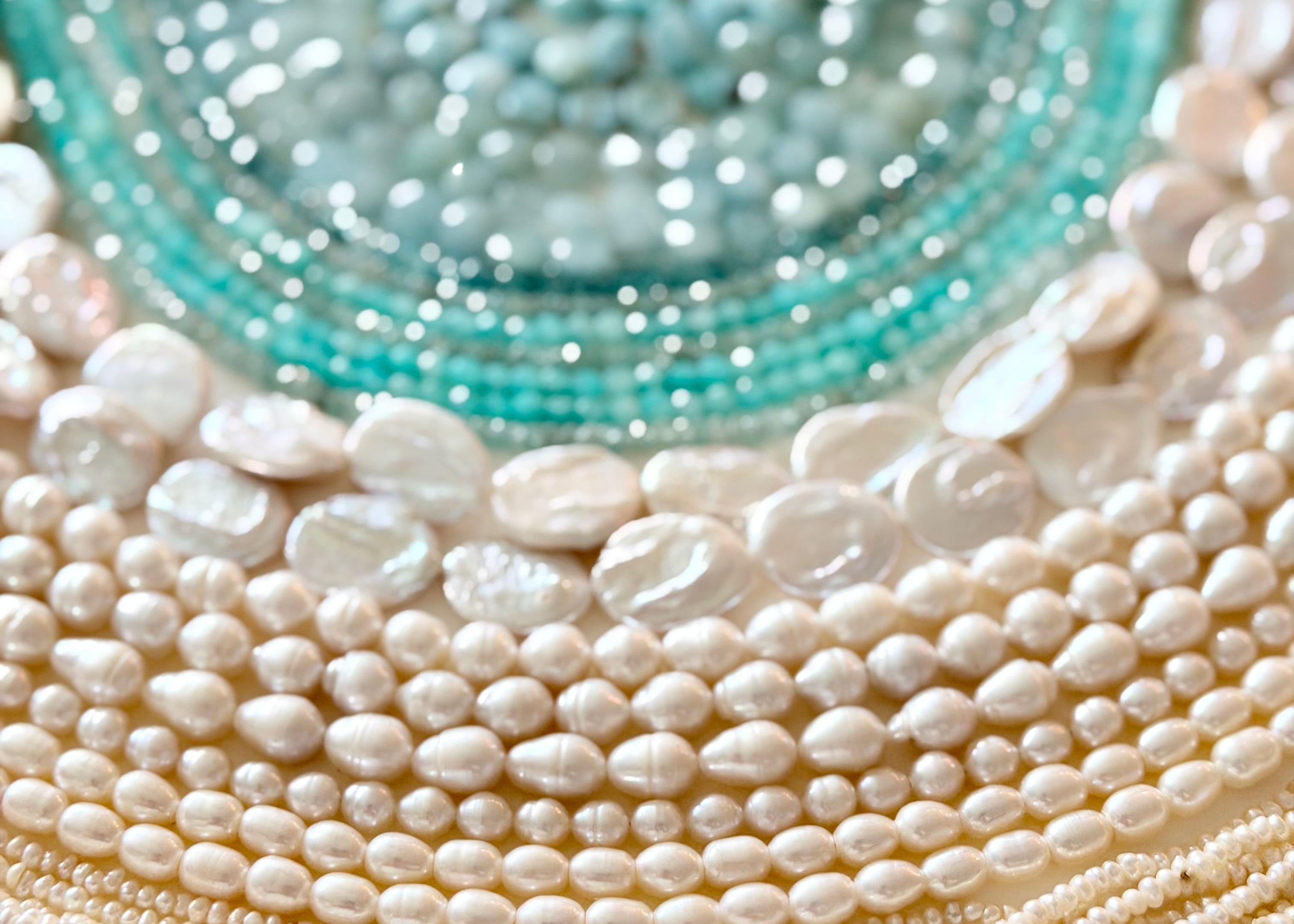 Close up image for turquoise gemstones and pearls 