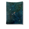 seascape birds eye view of a surfer on the dark and moody seas