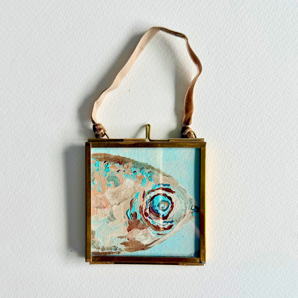 Little Catch No. 1 mini original fish painting in a brass frame with soft aqua, cream, taupe and blue brushstrokes.