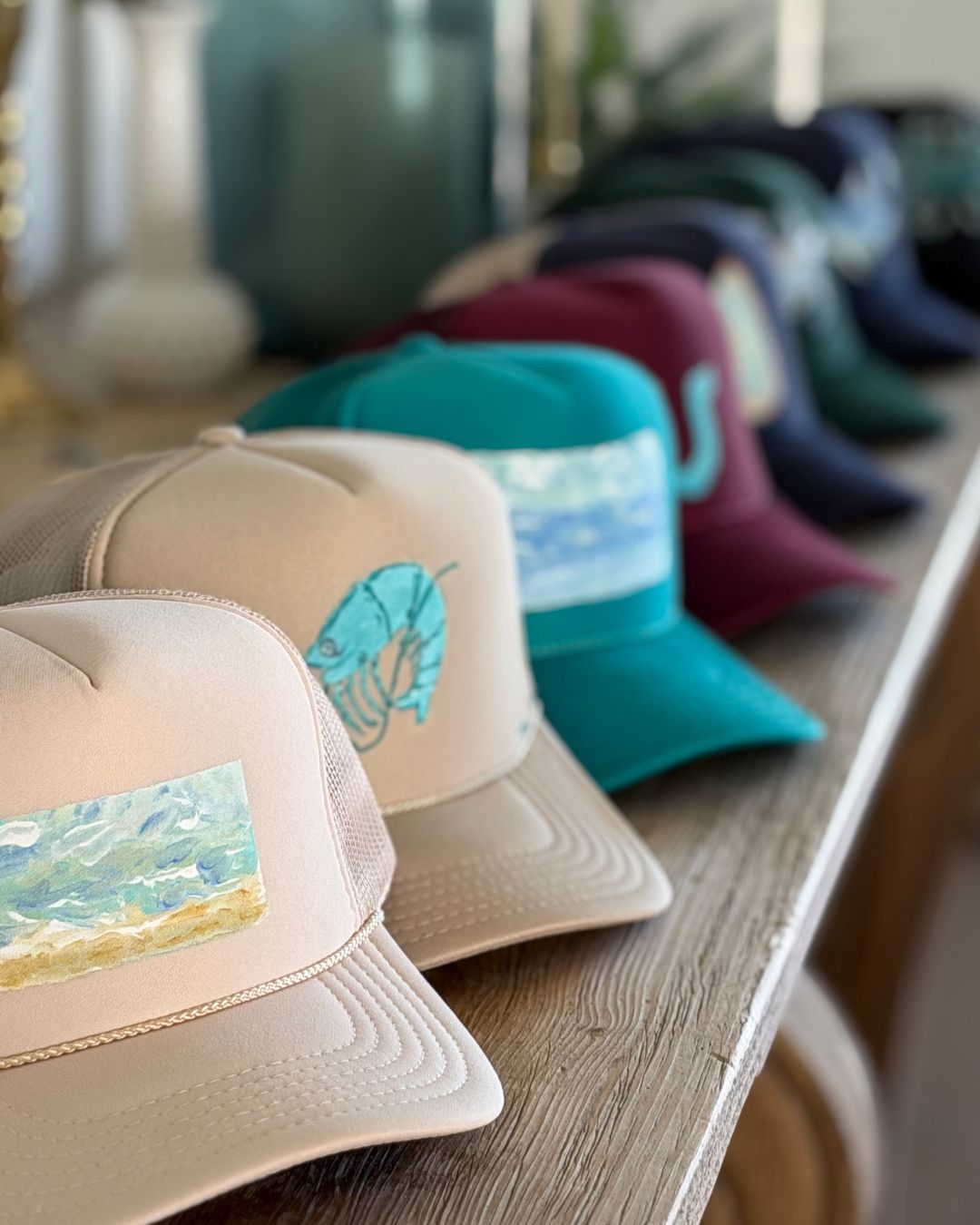 Collection of hand painted trucker hats by Tracy Marie 