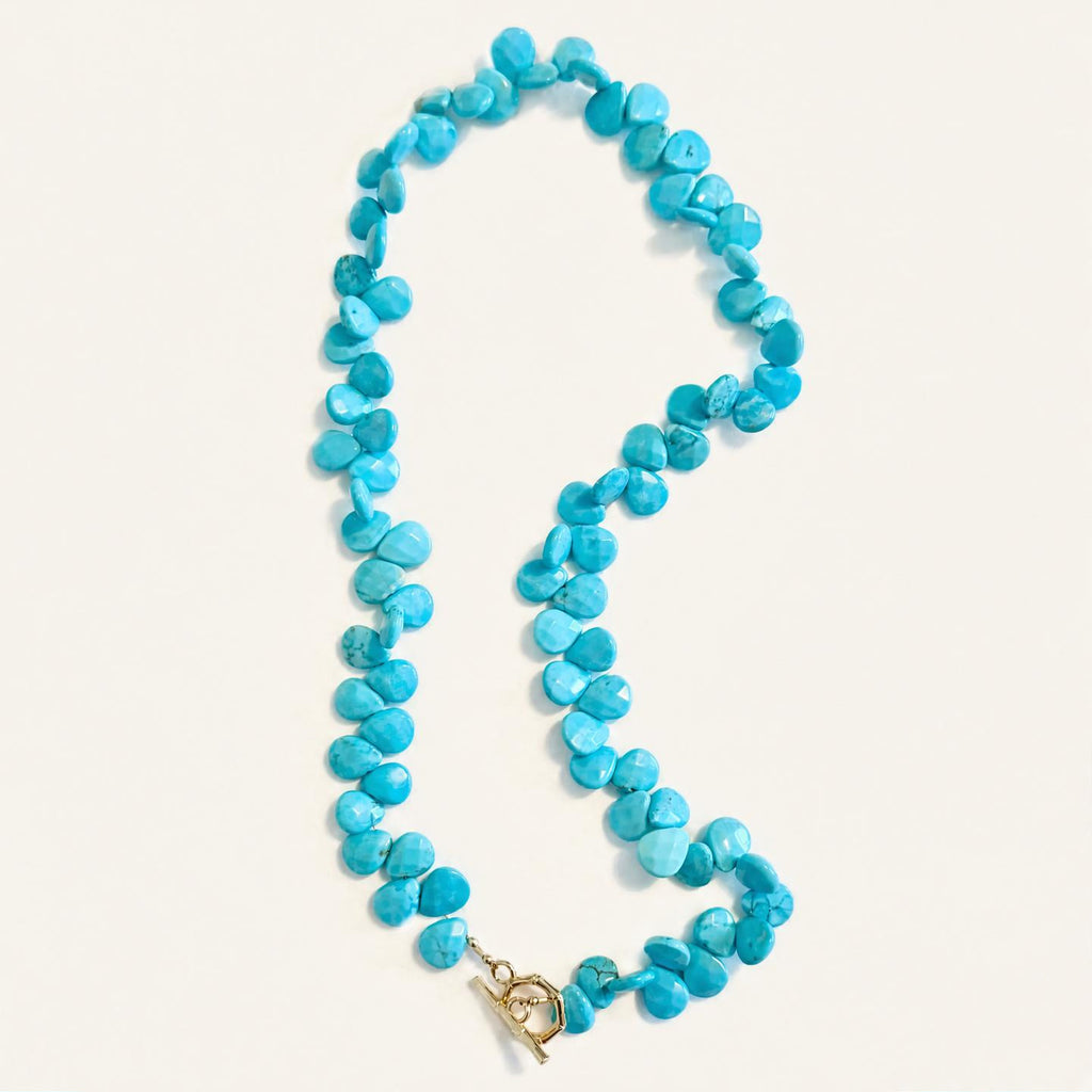 Turquoise Teardrop Necklace on light cream background