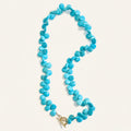 Turquoise Teardrop Necklace on light cream background