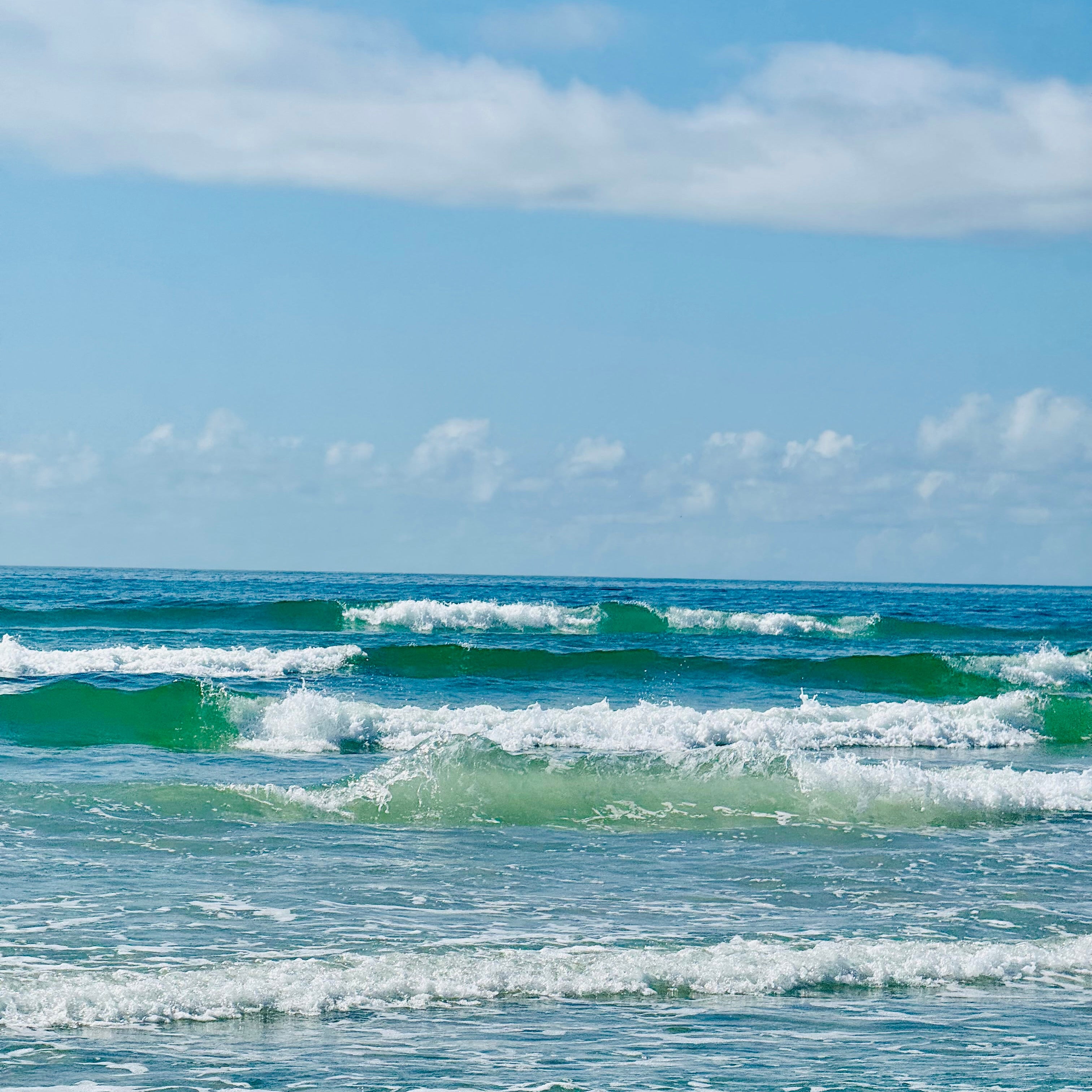 Ocean waves with a clear blue sky