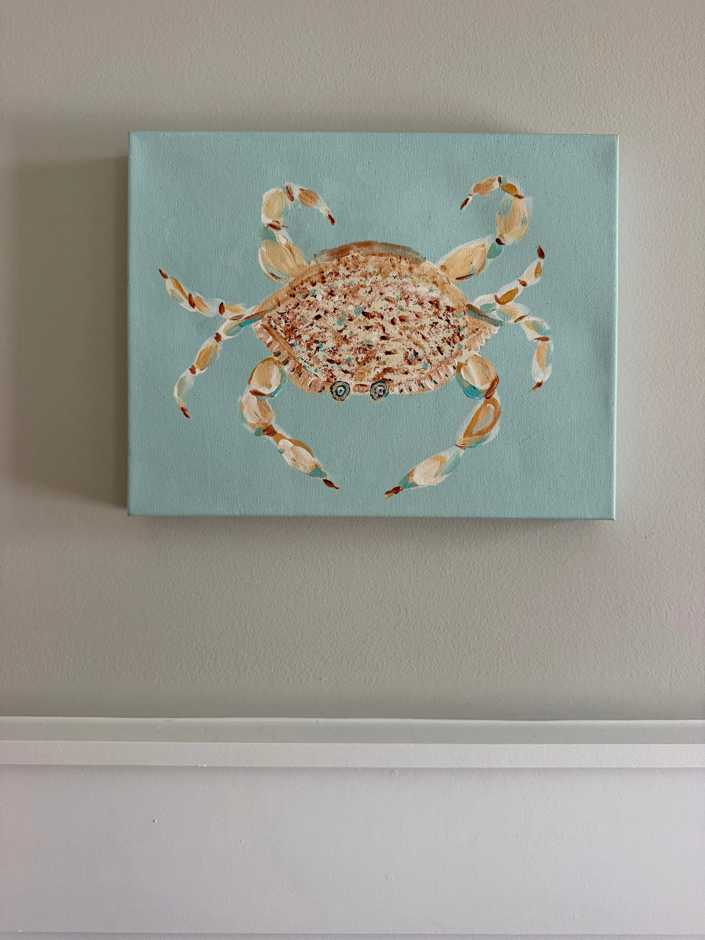 Whimsical blue crab original acrylic painting featuring peach, coral, and cream details against a soft turquoise background.