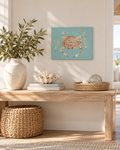Original acrylic blue crab painting on a seafoam turquoise canvas, styled above a natural wood console table with coastal décor.